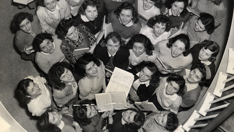 Getting ready to perform with Harvard's Glee Club in 1943. Rehearsal in Alumnae Hall. Photograph from the Pembroke College archives.