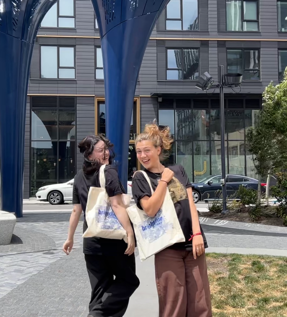 Sassan and fellow intern Nicole Gonzalez sport Brightline tote bags