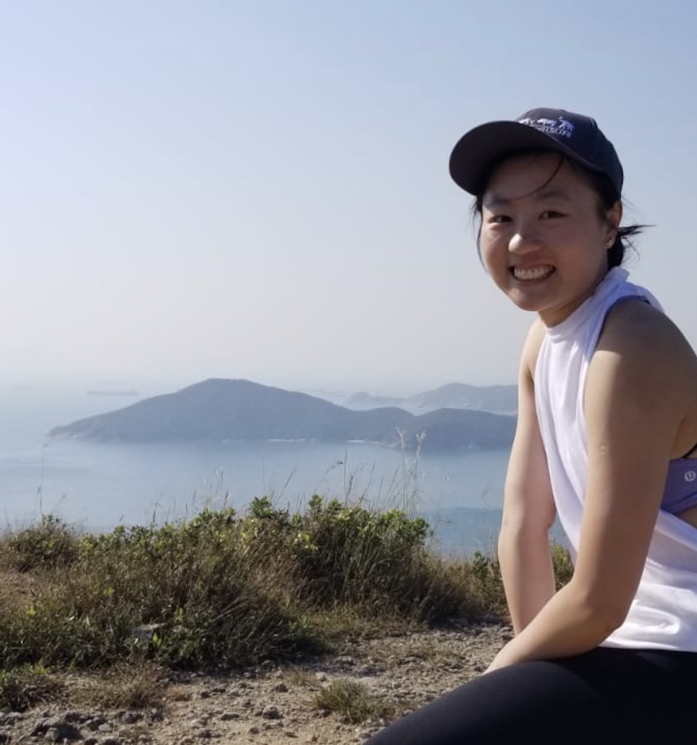 Jada smiles while taking a break on a hike in Hong Kong