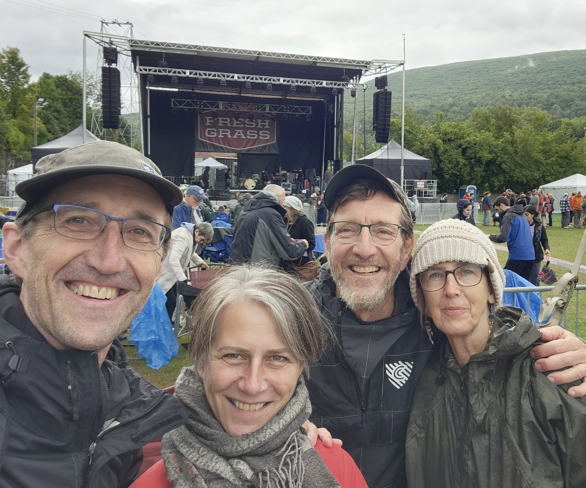 Roberts, Teichert, and their wives at a music festival