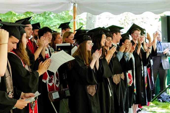 Graduates clapping