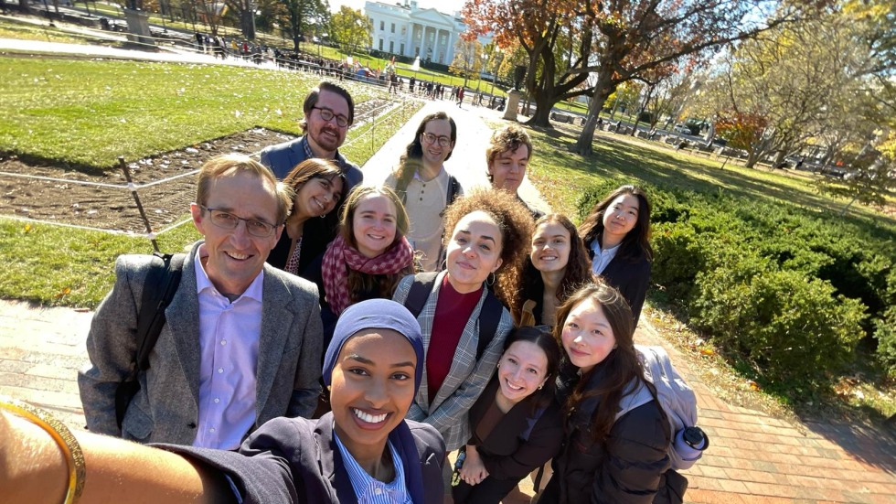 Members of the class take a selfie in front of the White House