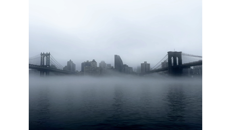 A foggy day in New York City, between the Manhattan Bridge and the Brooklyn Bridge
