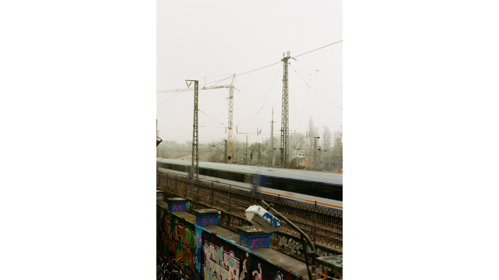 A train rushes by the dilapidated Schlachthofviertel (Slaughter House Quarter) on the outskirts of Munich
