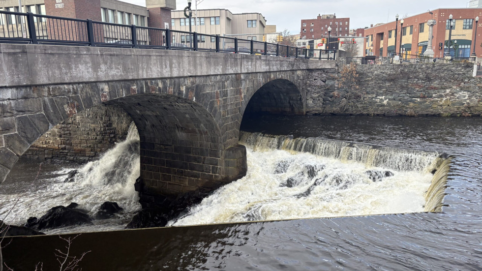 The Blackstone River flows underneath a bridge on Main Street in Pawtucket, R.I.