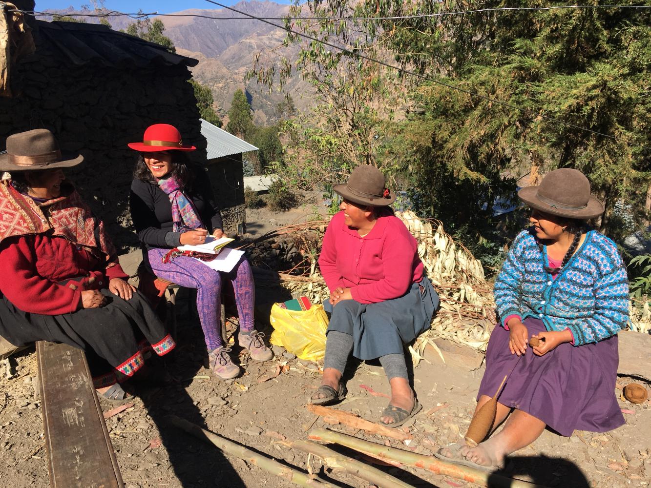 Mariaelena Huambachano conversing with a group of 'Andean seed keepers,'